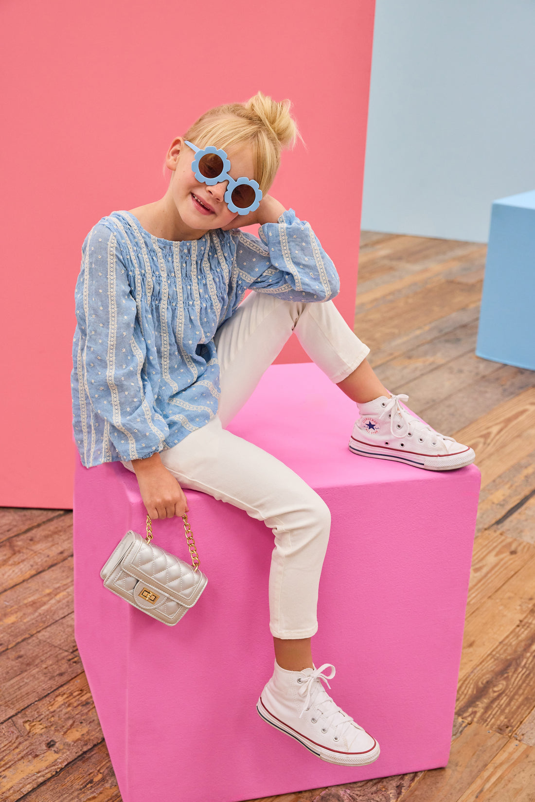 Model can be seen wearing a light blue shirt that features white dobby detailing and white lace stripes which pairs back perfectly with ivory jeans to complete the look.