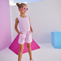 Girls/Tween model can be seen wearing knit romper in light purple/white stripe. Romper features a keyhole button closure at back , an elastic waistband, and pockets.