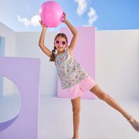Model can be seen wearing knit bubblegum pink shorts that feature an elastic waistband and functional pockets in the front of shorts. Shorts pair back perfectly with floral woven top to complete the look.