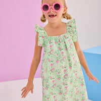 Girls/Tween woven dress in a light green/pink floral print. Dress features adjustable ruffle/angel sleeve straps with button closure at back for a secure but relaxed fit.