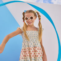Model can be seen wearing woven dress with blue and red floral print. Dress features angel sleeves and ruching at bust for a comfy and airy fit perfect for spring and summer.