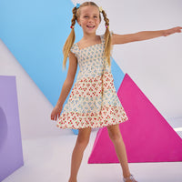 Model can be seen wearing woven dress with blue and red floral print. Dress features angel sleeves and ruching at bust for a comfy and airy fit perfect for spring and summer.