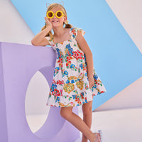 Model can be seen wearing woven dress with multi colored floral arrangement. Dress features angel sleeves and ruching at bust for a comfy and airy fit perfect for spring and summer.