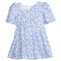 Girls/Tween woven dress in a royal blue and white floral pattern. Dress features a fun asymmetrical hem which adds a fun feature to the dress. Dress also has slight puff sleeves and also has a keyhole button closure on back of neckline.