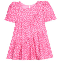 Pink "maple leaf" floral dress that features a button closure on back of neckline and asymmetrical pleating detail across body of dress.