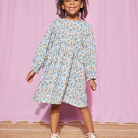 Model can be seen rocking our Elena Dress in our Jodphur Floral White pattern--BISBY girl
