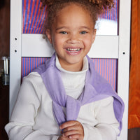 Model can be seen wearing our Ribbed Turtleneck in our Ivory color layered under our Lilac Polo Pullover paired to go with our Seville Azul Circle Skirt--BISBY girl