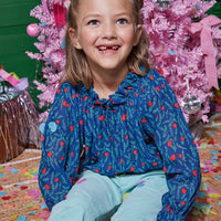 Model can be seen wearing our Navy Holly Tory Top which we have paired with our Aqua Velvet Twiggy Pants to create this cute look--BISBY girl
