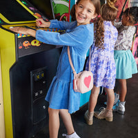 Our model in front can be seen wearing our Western Dress in our French Blue Corduroy. Our girls in the back can be seen wearing our Embry Dress in Soho Lilac Floral and our McCall Top in Autumn Paisley paired with our Aqua Velvet Circle Skirt-BISBY girl