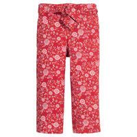 Girls red floral woven pant that features a button closure, two functioning pockets, and a functioning belt to complete the look.