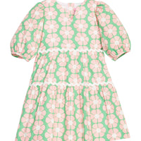 BISBY girl woven white dress in salmon pink/green floral print. Dress features three button closure along back, elastic cuffs at sleeve, and cream ric rac detail across tiers of dress for an elevated look.