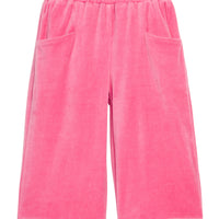 Girls pink velour palazzo pants that feature two functioning pockets in the front and an elastic waistband.