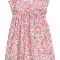 Girls pink and green floral dress with green piping along bust and trim of sleeves, that also features a four button closure along back of neckline.