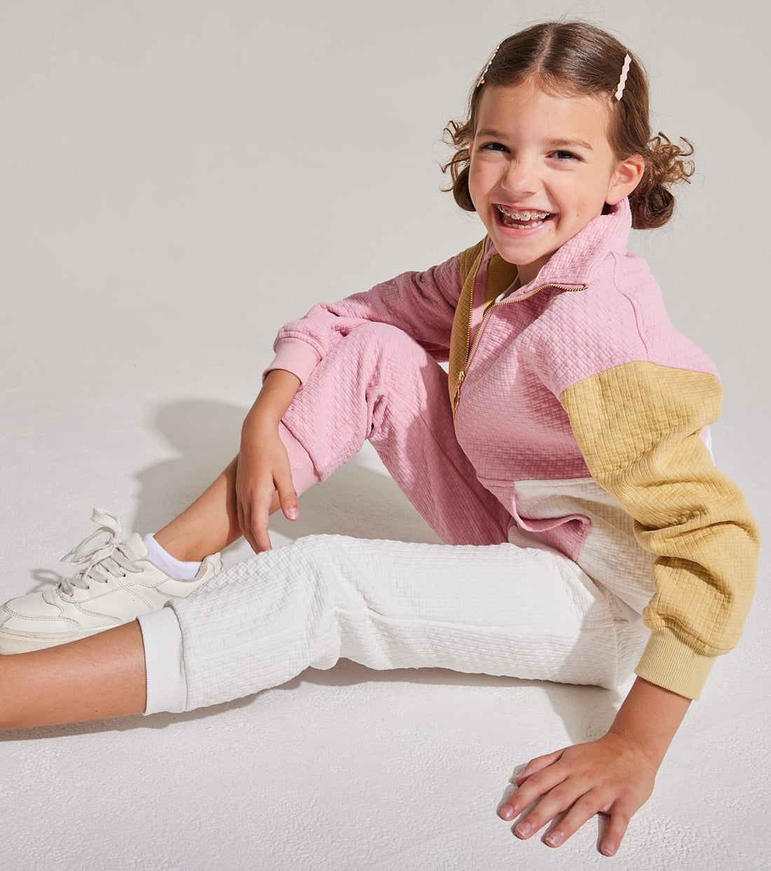 pink and white and gold color block split pants