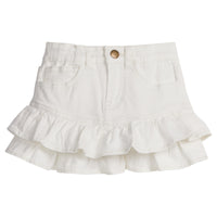 Girls/Tween denim skirt in ivory denim that features a two-tier ruffle at bottom of skirt. Skirt also features a snap button closure and pockets in the front.