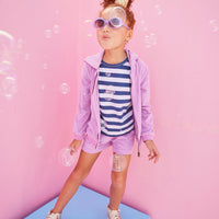 BISBY girl in our Navy/White/Metallic Stripe shirt paired underneath our Hoodie Short Set in Lilac Terry