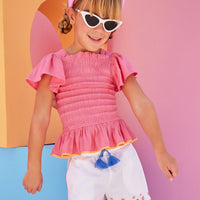Hot pink ruched smocked top for girls and tweens with orange trim 