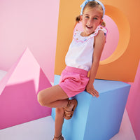 Model can be seen wearing our new Pink Basic Shorts in our rayon blend fabric which has an elastic waistband and pockets. We have paired the Kate Top in our Flower Market Embroidery.