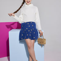 Girls/Tween skirt in navy with gold stars printed on it which also features an elastic waistband and built in shorts for a relaxed comfy fit. This skirt can go back with the ribbed turtleneck in ivory to complete the look.