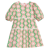 BISBY girl woven white dress in salmon pink/green floral print. Dress features three button closure along back, elastic cuffs at sleeve, and cream ric rac detail across tiers of dress for an elevated look.