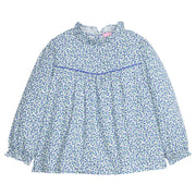 Girls/tween woven long sleeve top in a blue floral print that features a high neck ruffle neckline, button closure at back,  and a blue trim detail across the bust to elevate the look.