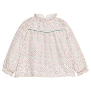 Girls/tween woven long sleeve top in a green and red floral print that features a high neck ruffle neckline, button closure at back,  and a green trim detail across the bust to elevate the look.