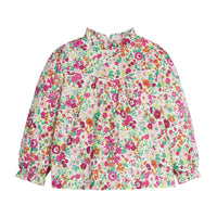 Girls/Tween top in our Magenta Floral which features a magenta/orange/pink/green floral arrangement. Top has a light pink trim detail along the bust, elastic cuffs on the sleeves, ruffles at the neckline, and there are buttons along back as well -BISBY