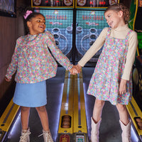 Girls wearing our Merion Floral Dress/Top paired with our essential turtleneck under dress and Blue Sherpa Mini Skirt with top-BISBY girls