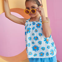 Tween girls top with BISBY blue flower pattern and square neck.