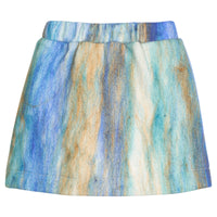 Girls/tween mini skort in a blue multi color wool material. Skort features an elastic waistband and built in shorts for a secure but relaxed fit.