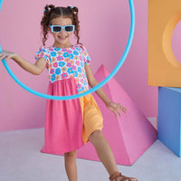 Pink and Orange Color blocked dress with vibrant flower pattern on top for girls and tweens by BISBY
