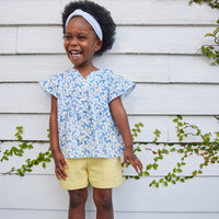 Our new textured Basic Shorts in our Popcorn color feature an elastic waistband and pockets and pairs perfectly back with our new Positano top in Piccadilly Blue.