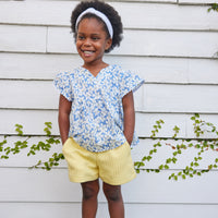 Our new textured Basic Shorts in our Popcorn color feature an elastic waistband and pockets and pairs perfectly back with our new Positano top in Piccadilly Blue.