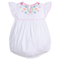Baby girl woven bubble with ruffle/angel sleeves and slight v-neck neckline and multi-color flowers printed across the top. The bust-line and sleeves are also lined with pink pom poms and there are button closures along the stride.