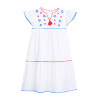tween girls white tiered dress with blue and red embroidery detail on chest and tassels
