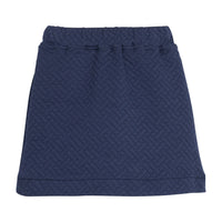 Girls/tween quilted mini skort in navy that features an elastic waistband and built in shorts for a secure but relaxed fit.