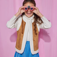 Girls/Tween velour skirt in a French blue color. Skirt features an elastic waistband and made of a super soft stretchy material for ultimate comfort. Model can be seen wearing a ribbed turtleneck in ivory underneath a reversible sherpa/suede vest to complete the look.