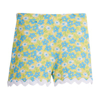 Girls/Tween knit shorts in a yellow/green/aqua floral print. Shorts feature an elastic waistband for a comfy fit and also have a gorgeous white ric rac detail along bottom.
