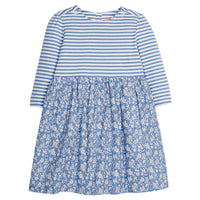 Girls dress in our Roland Floral Blue floral pattern which features a blue and white knit top half and woven floral pattern on bottom half. Dress is super lightweight and has button enclosures on the back and at top of sleeves-BISBY