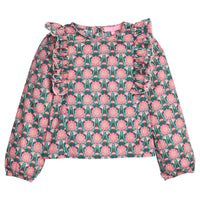 Girls/tween woven long sleeve top in pink/green floral that features ruffle detail along body/sleeves, elastic cuffs at sleeve ends, and button closures along back.