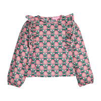 Girls/tween woven long sleeve top in pink/green floral that features ruffle detail along body/sleeves, elastic cuffs at sleeve ends, and button closures along back.