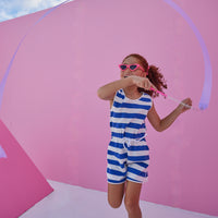 Girl/tween woven romper with pockets and elastic tie waistband with thick royal blue and white stripes.