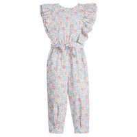 Girls/Tween woven jumpsuit that features ruffle detail along the front/sleeves, pockets, and a front tie with an open back. Jumpsuit has a beautiful pale yellow/pink/green/blue floral pattern and is a lightweight woven material for ultimate comfort.