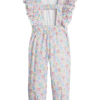 Girls/Tween woven jumpsuit that features ruffle detail along the front/sleeves, pockets, and a front tie with an open back. Jumpsuit has a beautiful pale yellow/pink/green/blue floral pattern and is a lightweight woven material for ultimate comfort.