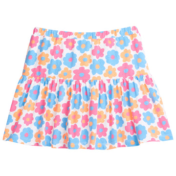 Girl/tween knit skort, with built in shorts, elastic waistband, and slight ruching along bottom. Skort is a colorful floral print with orange, pink, and blue flowers printed across it.
