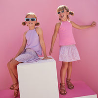 BISBY girls rocking our new Shirred Circle Skirts in our Pink and Purple Daisy patterns. The skirts have ruching along the waist for a stretchy comfortable feel and pair perfectly back with our Halter Tops in Lavender or Pink.