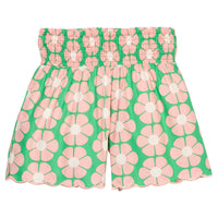 BISBY girl woven shorts with a green and salmon pink floral print. Shorts feature a smocked waistband, pockets, and a scallop bottom hem for an elevated look.