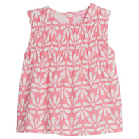 Girls/Tween sleeveless woven top in a salmon/pink and white floral print. Top features ruching at the bust and fans out for a relaxed comfy fit.