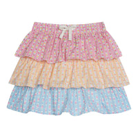 Tiered skort with built in shorts and elastic waistband with faux tie. Top tier of skirt has pink daisy pattern, middle tier has orange daisy pattern, and bottom tier has light blue daisy pattern.