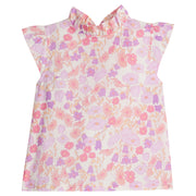 Girls/Tween thin woven top in a lavender/salmon pink/cream floral pattern. Shirt features angel sleeves, ruffle collar, and button closures at back for a relaxed but secure fit.